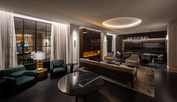 A living room filled with furniture and a table