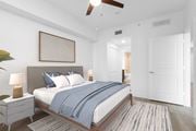 Plantation apartment for rent - a bedroom with a large bed and a ceiling fan at One Plantation in Florida 33324