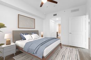 Plantation apartment for rent - a bedroom with a large bed and a ceiling fan at One Plantation in Florida 33324