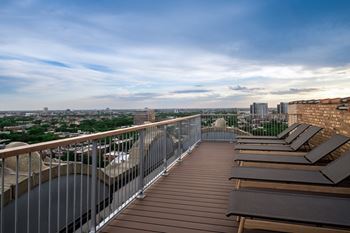 Rooftop deck with soft seating & 360 views of lincoln park, & lake michigan