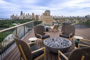 Rooftop deck with soft seating & 360 views of lincoln park, & lake michigan