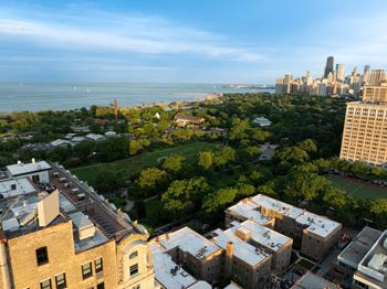 Rooftop deck with soft seating & 360 views of lincoln park, & lake michigan
