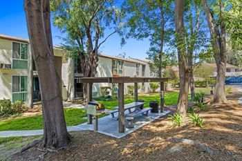 Tree-lined outdoor dining area at veranda la mesa in la mesa, ca 91942