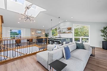 Renton apartment for rent - A modern living room with a grey couch and a black coffee table.