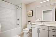 Minneapolis apartment for rent - A white bathroom with a toilet, sink, and bathtub.