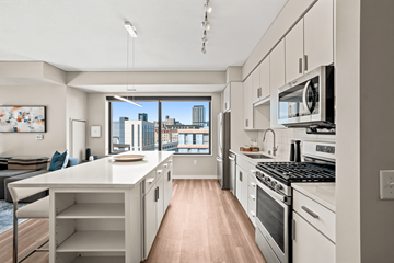 Minneapolis apartment for rent - A modern kitchen with a view of the city.
