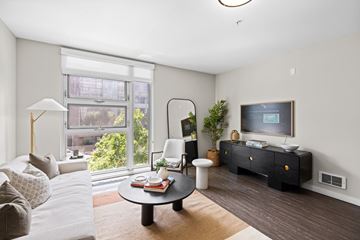 San Francisco apartment for rent - A living room with a white couch and a black coffee table.