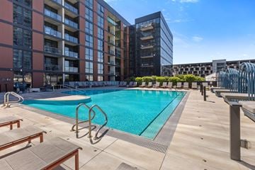 Chicago apartment for rent - A large outdoor swimming pool surrounded by apartment buildings.