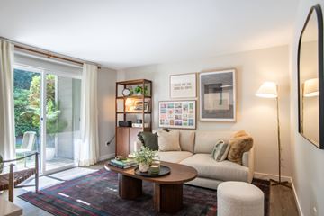 Edmonds apartment for rent - A living room with a white couch and a coffee table.