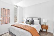 Atlanta apartment for rent - A bedroom with a bed, nightstand, and a picture on the wall at 903 Peachtree in Atlanta, Gerogia