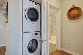 A front loading washer and dryer in a laundry room