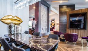Las Vegas apartment for rent - a dining room with a table and chairs and a television