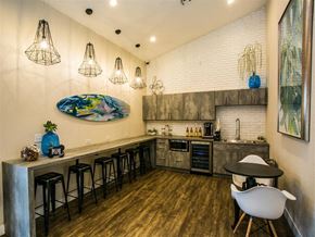 Las Vegas apartment for rent - a kitchen with a long counter and a bar with chairs