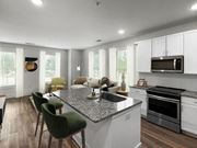 Charleston apartment for rent - a kitchen and living room with a granite counter top at The Merchant Apartments, Charleston, South Carolina