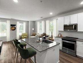 Charleston apartment for rent - a kitchen and living room with a granite counter top at The Merchant Apartments, Charleston, South Carolina