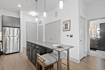 Elegant kitchen with stunning cabinetry and stainless steel appliances 