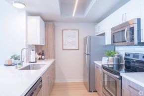San Pedro apartment for rent - a kitchen with stainless steel appliances and white counter tops at Vue, San Pedro, CA 90731