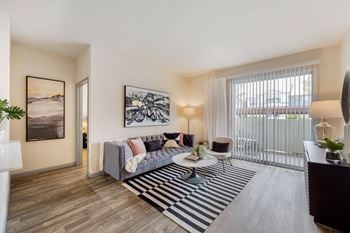 Open living room with a couch and a coffee table