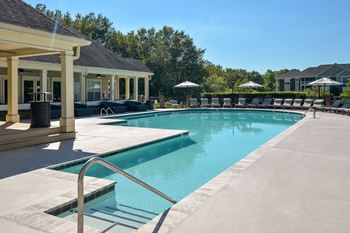 The resort style pool is in front of the pool house