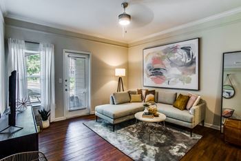 A living room with a couch and a table