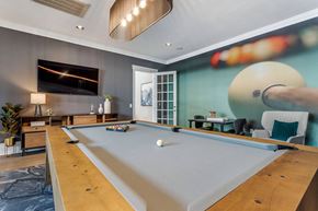 Houston apartment for rent - a game room with a pool table and a tv at Reserve by the Lake, Houston, TX, 77084