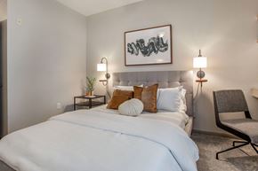 Houston apartment for rent - a bedroom with a large white bed and pillows at Reserve by the Lake, Houston, Texas