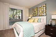 Woodland Hills apartment for rent - A bedroom with a large bed and a window with blinds. at The Kitt at Warner Center Apartments, Woodland Hills, California
