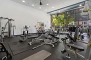 Woodland Hills apartment for rent - A gym with a variety of equipment including weights and machines at The Kitt at Warner Center Apartments, Woodland Hills, California