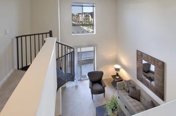 Woodland Hills apartment for rent - A living room with a couch, chair, and a small table with a lamp on it.