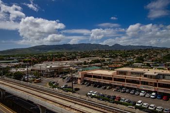 Aerial view of a city with train tracks and a building