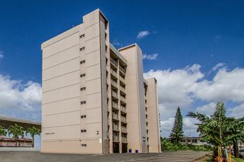 Large white building with a blue sky in the background
