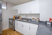 Waipahu apartment for rent - a kitchen with white cabinets and stainless steel appliances and a sink at Waikele Towers Apartments, Waipahu, Hawaii