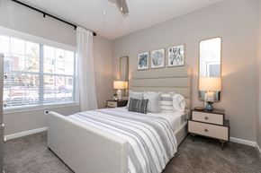Atlanta apartment for rent - a bedroom with a bed and a large window at Willowest in Collier Hills, Georgia, 30318