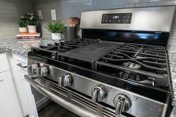 A close up of a stove top oven in a kitchen