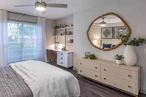 Roswell apartment for rent - a bedroom with a bed and a mirror at Roswell Village, Roswell, Georgia