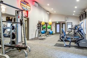 Edmonds apartment for rent - A gym with a variety of equipment including treadmills, weights, and exercise balls at Brackett Apartments, Edmonds, WA