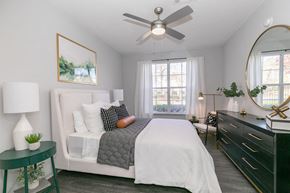 Alpharetta apartment for rent - a bedroom with a bed and a ceiling fana bedroom with a bed and a ceiling fan at Deerfield Village, Georgia, 30004