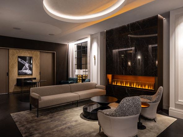 Chicago apartment for rent - a living room with couches and chairs and a fireplace  at The Belden Stratford, Illinois