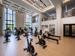 Chicago apartment for rent - a gym with weights and exercise equipment in a large room  at The Belden Stratford, Chicago, IL
