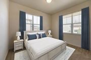Littleton apartment for rent - a bedroom with a bed and two windows at Switchback on Platte Apartments, Littleton, 80120