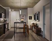 Chicago apartment for rent - A modern kitchen with a dining table and chairs. at The Mason Apartments, Chicago
