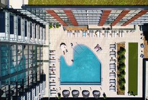 Chicago apartment for rent - A swimming pool surrounded by lounge chairs and umbrellas. at The Mason Apartments, Illinois, 60607