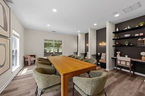 Greenville apartment for rent - A dining room with a wooden table and chairs.
