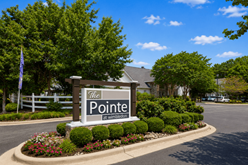 Greenville apartment for rent - A sign that says "The Pointe at Wimbledon" in front of a building.
