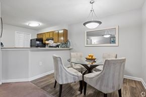 Greensboro apartment for rent - A dining room with a glass table and four chairs.