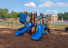 Winston-Salem apartment for rent - a playground at a park with slides and a clock