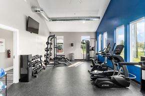Reynoldsburg apartment for rent - A gym with a variety of equipment including treadmills, weights, and exercise machines at Estates at Brentwood Lake Apartments, Ohio, 43068