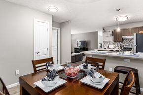 Reynoldsburg apartment for rent - A dining room with a table set for two at Estates at Brentwood Lake Apartments, Reynoldsburg, 43068