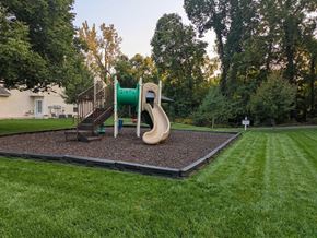 Blue Springs townhouse for rent - A playground with a green slide and a yellow slide.
