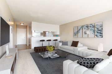 Santa Cruz apartment for rent - a living room with white couches and a coffee table